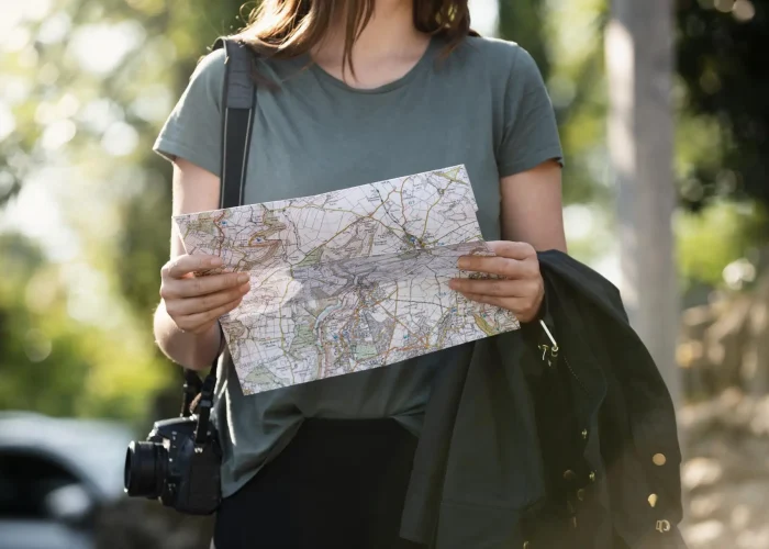 young-female-traveler-checking-map